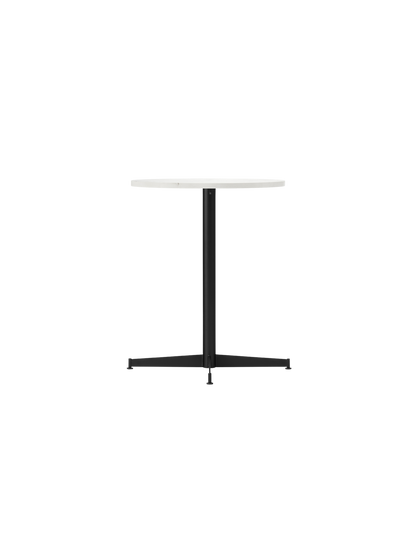 The Nook Dining Table shown at an angle, featuring a round Estremoz marble top and a slim, four-star base in black steel.