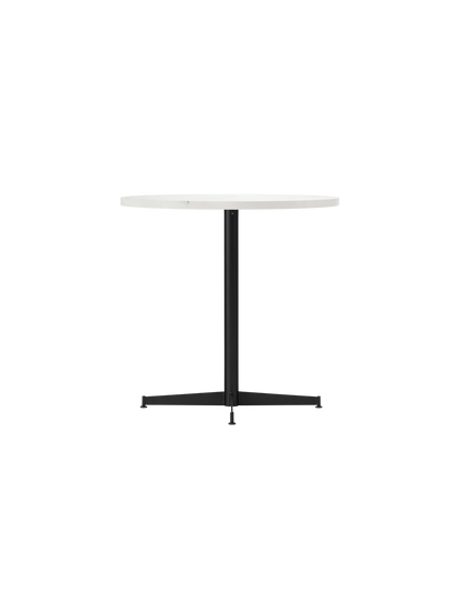 Angled view of the Nook Dining Table, featuring a round white tabletop and a black powder-coated steel four-star base.