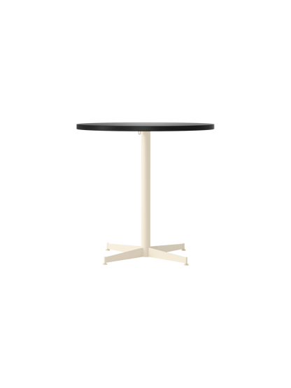 Front view of the Nook Dining Table with a round, charcoal linoleum tabletop and an ivory powder-coated steel four-star base.