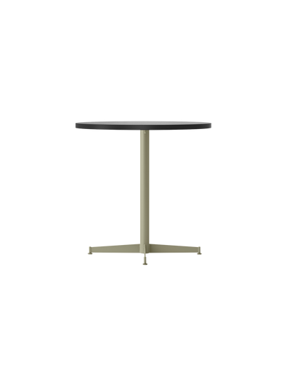 An angle view of the Nook Dining Table, featuring a dark round tabletop and a central olive-coloured steel pedestal base.