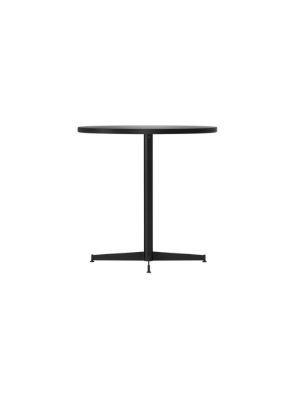 An angle view of the Nook Dining Table, showing its round dark top, slim central stem, and four-star base.