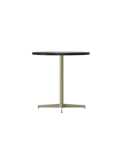 Angle view of the Nook Dining Table with a round, dark tabletop and an olive four-star pedestal base.