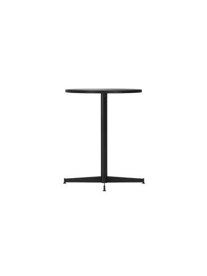 Angle view of the Nook Dining Table with a round charcoal linoleum top and a slim, four-star black steel base.