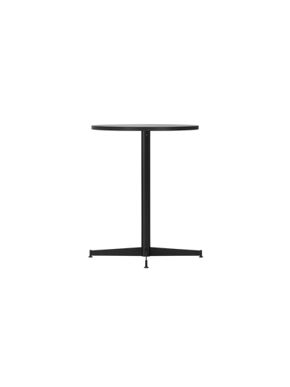A side view of the Nook Dining Table with a round black oak top and slim, black four-star metal base on a black background.