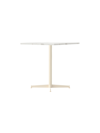 Front view of the Nook Dining Table, featuring a square Estremoz marble tabletop and a slim, ivory-coloured four-star base.