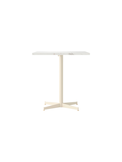 Front view of the Nook Dining Table with a rectangular Estremoz Marble top and an ivory powder-coated steel four-star base.