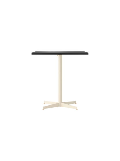 Front view of the Nook Dining Table with a rectangular charcoal linoleum top and an ivory powder-coated steel four-star base.