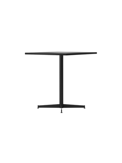 Angled view of the Nook Dining Table, showcasing its rectangular top and slender black powder-coated steel four-star base.