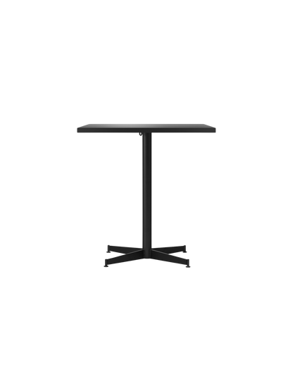 Front view of the rectangular Nook Dining Table in black oak veneer with a black powder-coated steel four-star base.