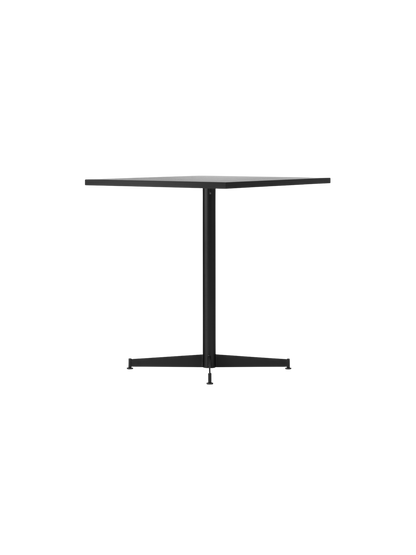 Angled view of the Nook Dining Table, its rectangular stone tabletop and slim, black powder-coated steel four-star base.