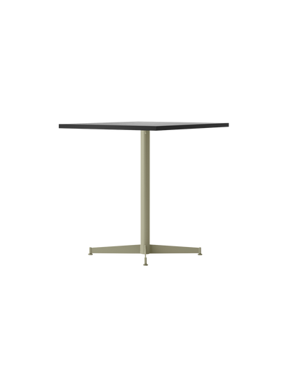 A side view of the Nook Dining Table, with a dark square tabletop and an ivory powder-coated steel base with four legs.