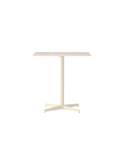 Front view of the Nook Dining Table with a rectangular Kunis Breccia stone top and ivory powder-coated steel four-star base.