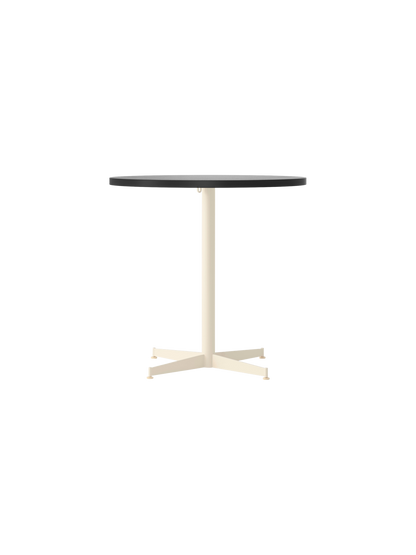 Front view of the round Nook Dining Table, featuring a dark top and a contrasting ivory-coloured, four-star pedestal base.