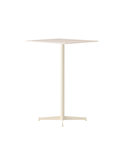 The Nook Bar Table, shown at an angle, features an ivory finish, a square top, and a central column on a four-legged base.