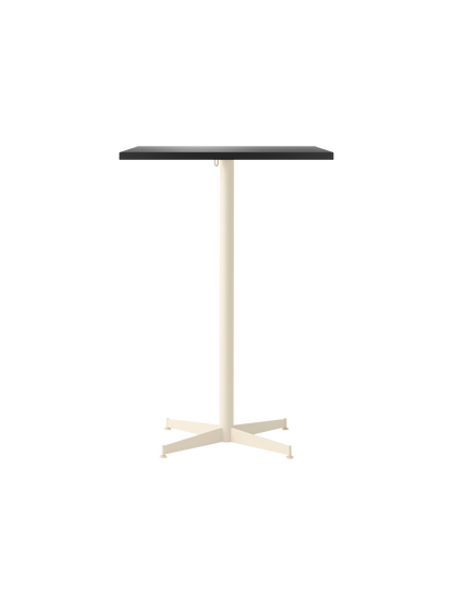 Front view of the Nook Bar Table, with a rectangular dark tabletop and a contrasting ivory, four-pronged steel base.