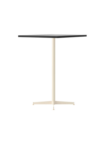 An angled shot of the Nook Bar Table, featuring a rectangular Kunis Breccia stone top and an ivory-coloured steel base.