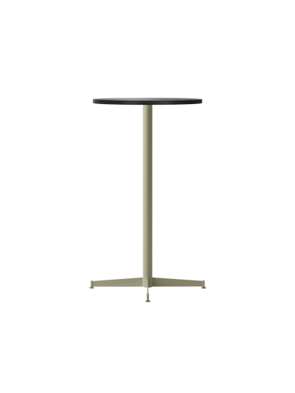 The Nook Bar Table, shown at an angle, with a round charcoal linoleum tabletop and a slim olive green steel base.