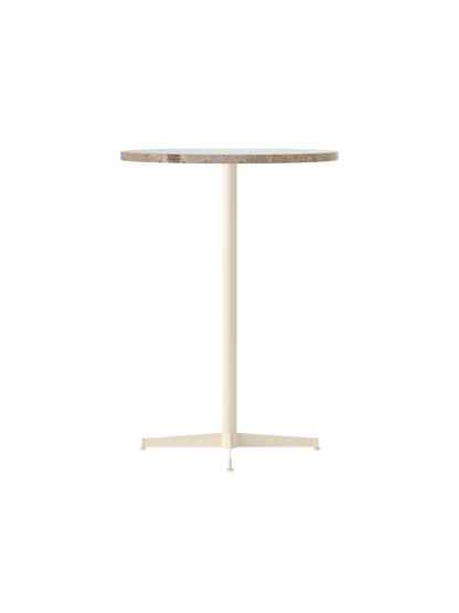 The Nook Bar Table with a round Kunis Breccia stone top and a slender, ivory powder-coated steel pedestal base.