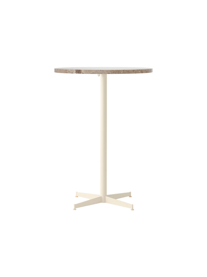 Front view of the Nook Bar Table with a round Kunis Breccia stone top on a slender ivory-coloured steel base with four feet.
