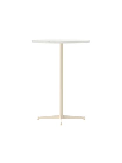 Angle view of the Nook Bar Table with a round white top and an ivory pedestal base with four feet, on a black background.