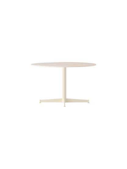 The Nook Lounge Table with an Estremoz Marble top and an ivory powder-coated steel four-star base against a black background.