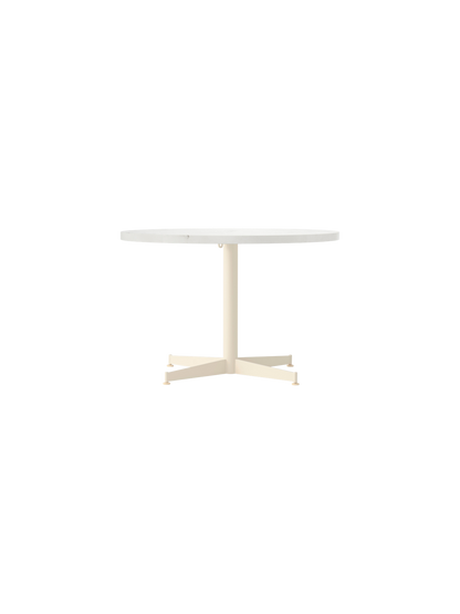 Front view of the Nook Lounge Table with a round Estremoz marble top and a slender, ivory powder-coated four-star base.