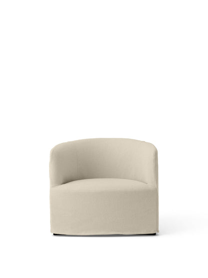 Front view of the Tearoom Lounge Chair with a light beige Logan Jasmine loose cover and a solid, fully upholstered base.