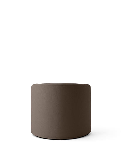 A cylindrical Tearoom Pouf upholstered in a textured, dark brown Logan Flint fabric, shown against a plain white background.