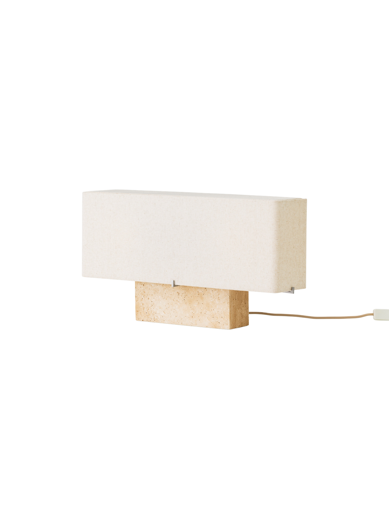 Side view of the wide Nonna Table Lamp with a rectangular travertine base and sand-coloured linen shade, shown switched off.