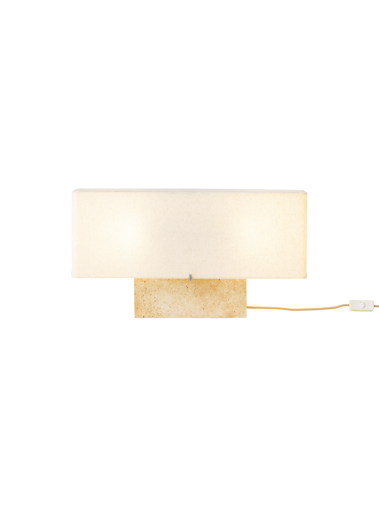 Front view of the wide Nonna Table Lamp in Travertine, featuring an illuminated rectangular sand-coloured shade on a base.