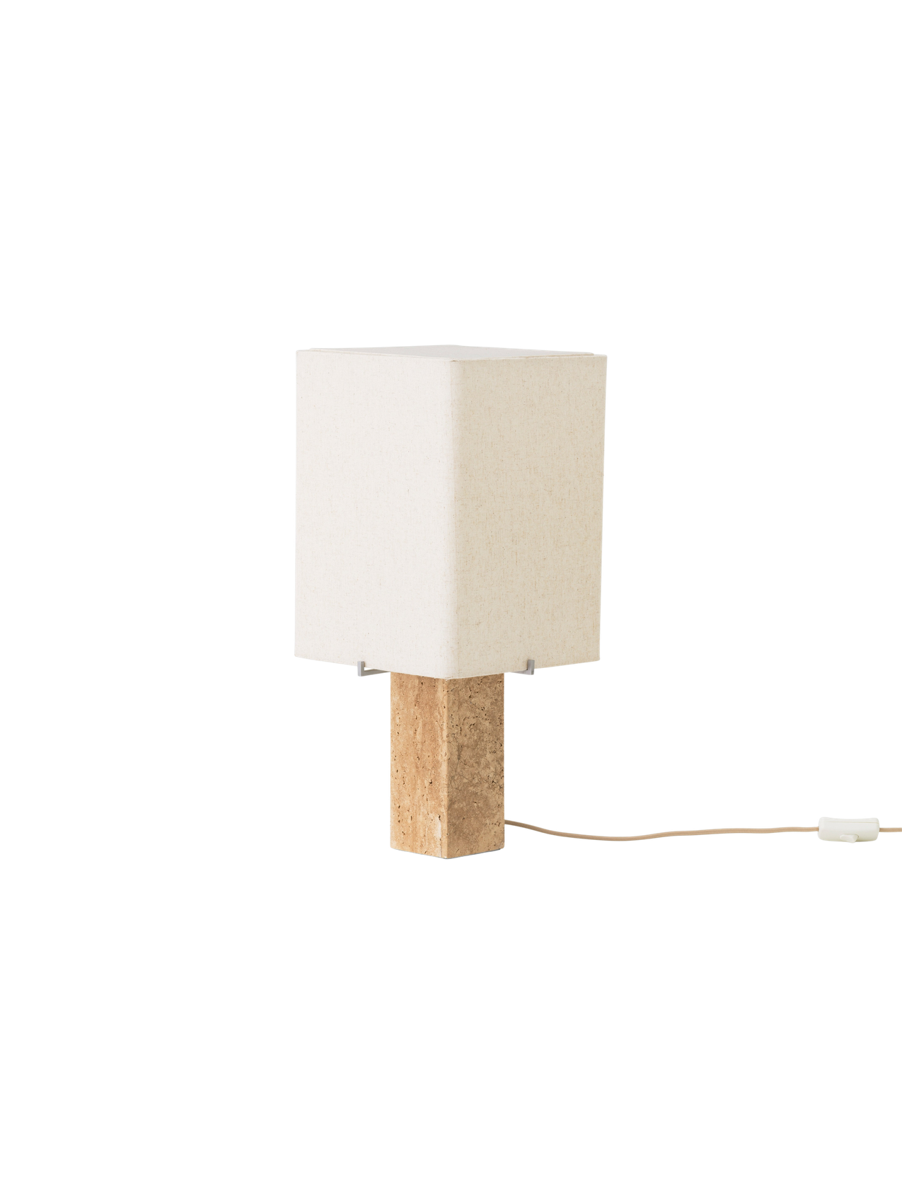 Angled view of the Nonna Table Lamp, off. It features a rectangular travertine base and a square, sand-hued shade.