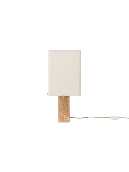 Front view of the switched-off Nonna Table Lamp, showing its rectangular travertine base and sand-coloured linen shade.