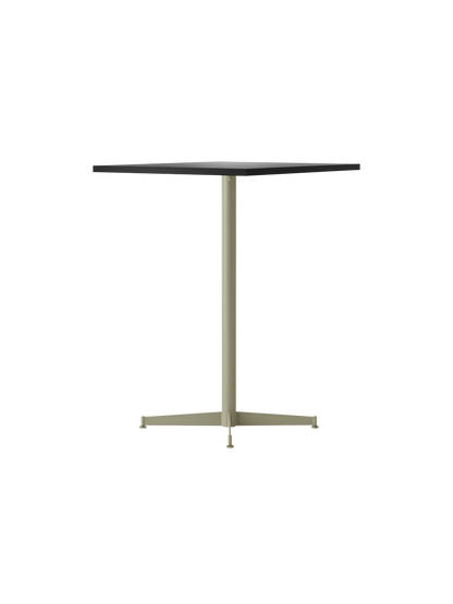 An angled view of the Nook Counter Table with a rectangular charcoal linoleum top on a slender olive pedestal base.