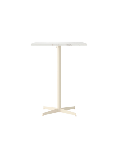 Front view of the Nook Counter Table with a rectangular white marble top and slim ivory pedestal base with four feet.