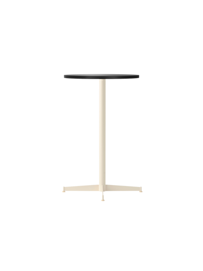 The Nook Counter Table with a round charcoal linoleum top and an ivory powder-coated steel base, shown from an angle.