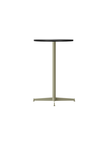 Angled view of the Nook Counter Table with a circular charcoal linoleum top and slender olive metal pedestal base.
