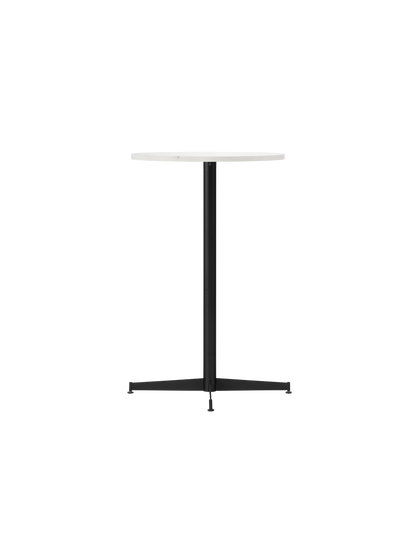 An angled view of the Nook Counter Table with a round white Estremoz marble top and black powder-coated steel pedestal base.
