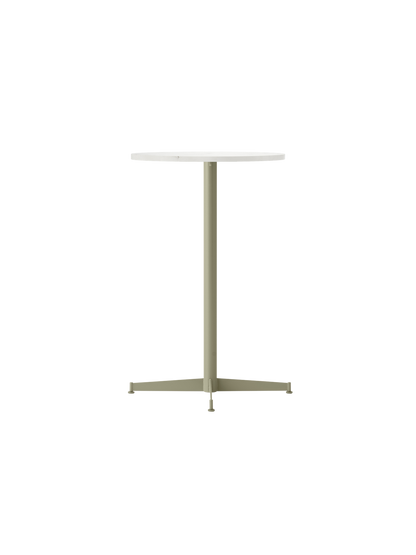 Angle view of the Nook Counter Table with a round Estremoz marble top and a slender, olive green powder-coated base.
