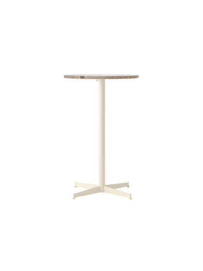 Front view of the Nook Counter Table, featuring a round Kunis Breccia stone top and a slender, four-legged ivory base.
