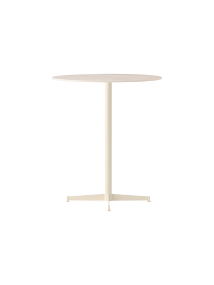 Nook Counter Table in an ivory finish, seen from an angle. It has a circular top, slim central leg and a four-star base.