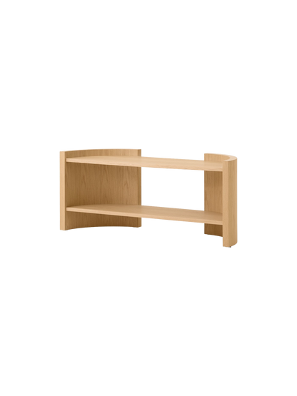 Angle view of the Passage Lounge Table in natural oak, showcasing its two curved shelves and minimalist design.