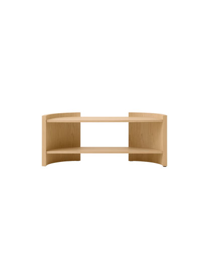 Front view of a low, curved, two-tiered console table in a light oak finish, set against a solid black background.