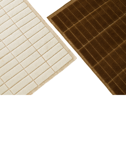 Close-up detail of two rugs against a black background: one light beige, one dark brown, both with a tufted grid pattern.