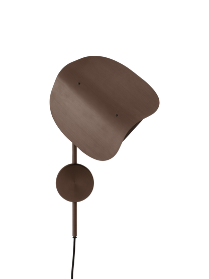 The Wing Wall Lamp in bronzed aluminium, turned off against a black background. It has a distinctive wing-shaped shade.