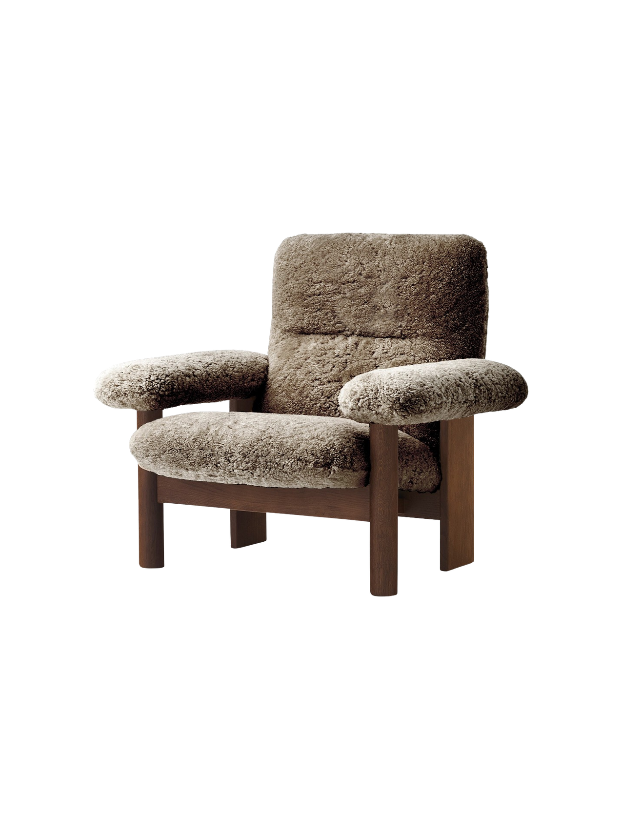 The Brasilia Lounge Chair in brown sheepskin. It has a high back, exaggerated armrests, and a sturdy dark wooden frame.