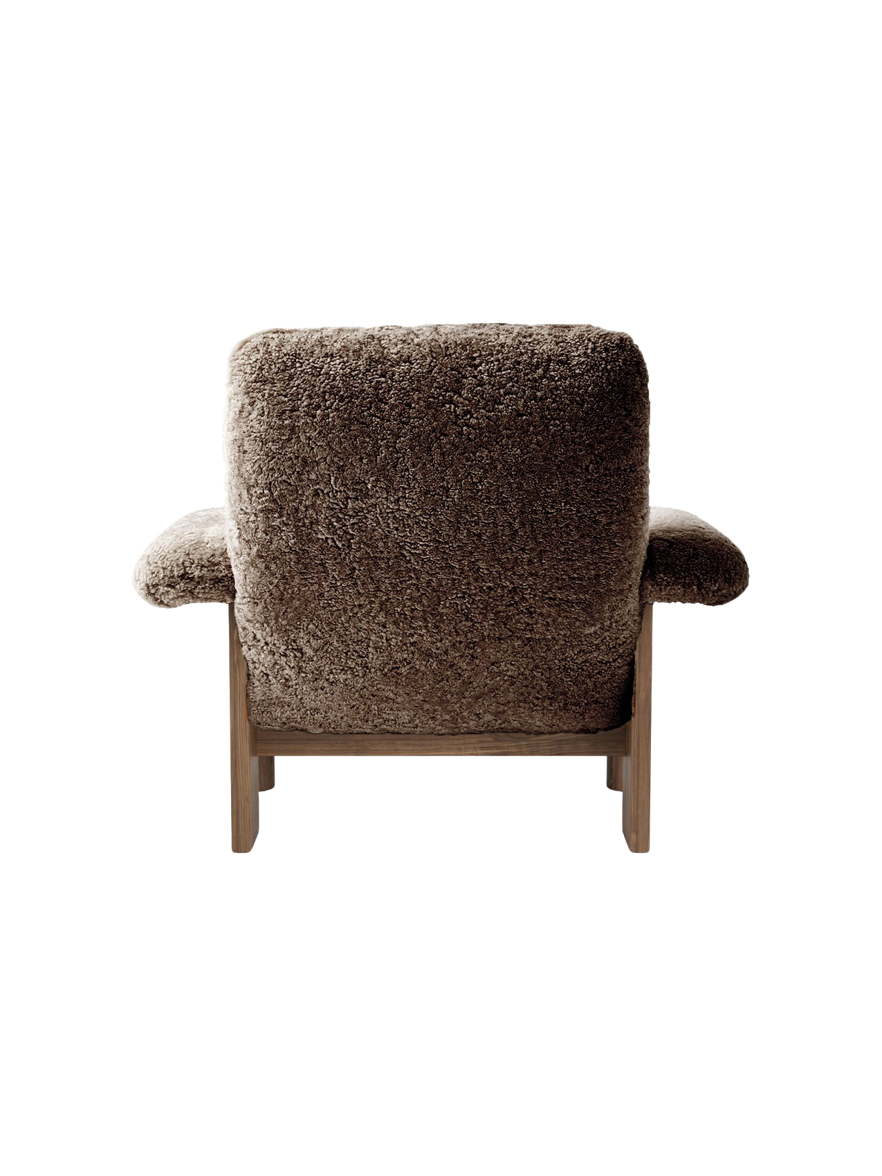 Rear view of the Brasilia Lounge Chair, High Back, in brown sheepskin with a dark walnut frame on a black background.