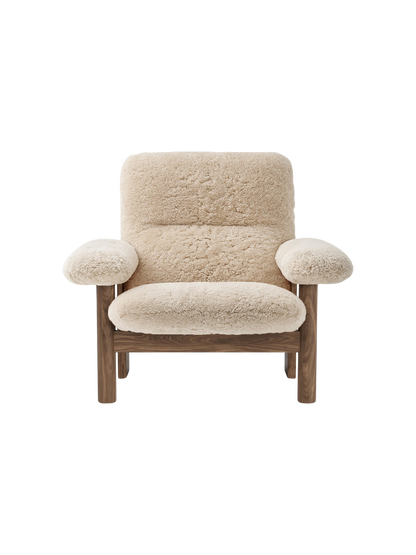 Front view of the Brasilia Lounge Chair, High Back, Sheepskin. With a dark wood frame and plush cream sheepskin upholstery.