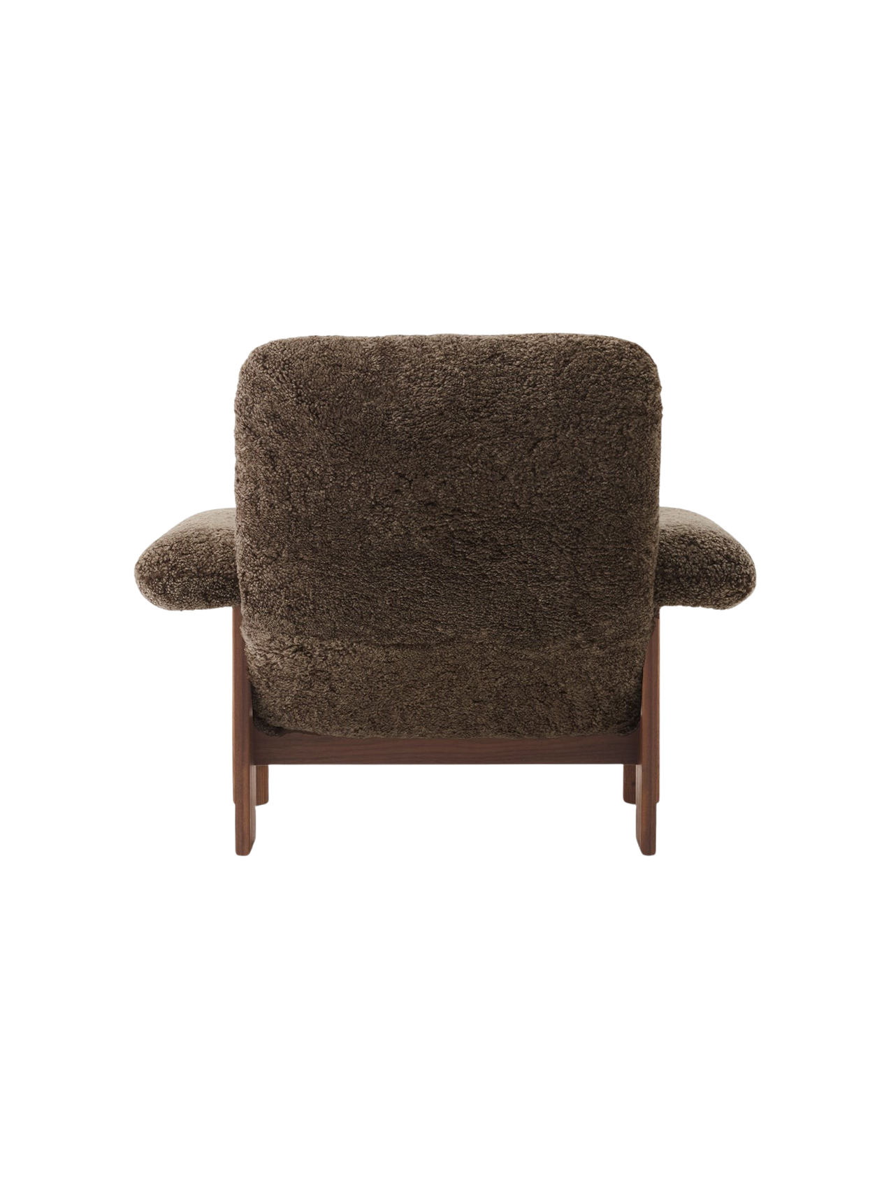 Back view of the Brasilia Lounge Chair, upholstered in fluffy dark brown Sheepskin Root with a dark walnut wood frame.