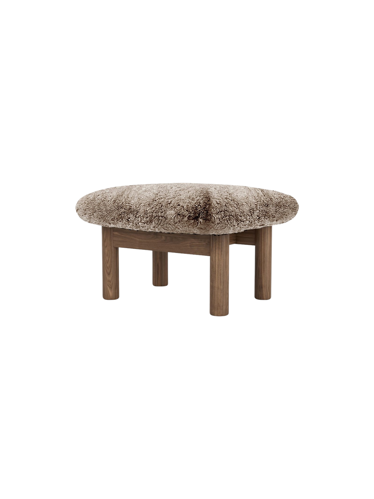 Brasilia Ottoman with a plush sheepskin cushion in a light brown hue, supported by four robust, cylindrical wooden legs.