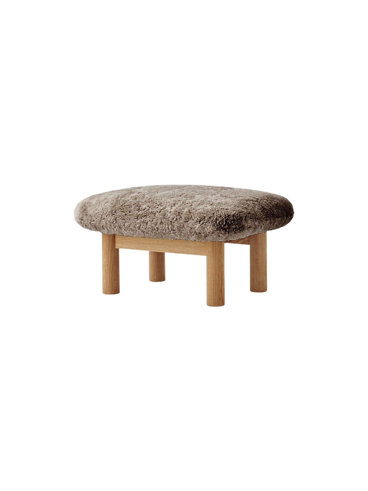 The Brasilia Ottoman, featuring a plush Sheepskin Nature cushion on a solid natural oak frame with four robust legs.